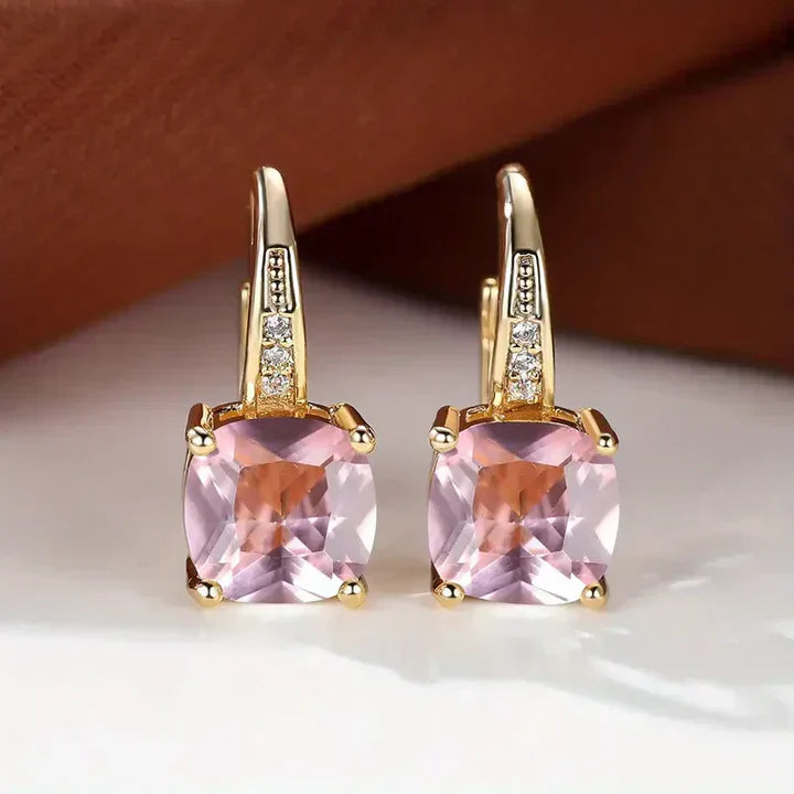 Pendientes de aro de oro con piedras misteriosas