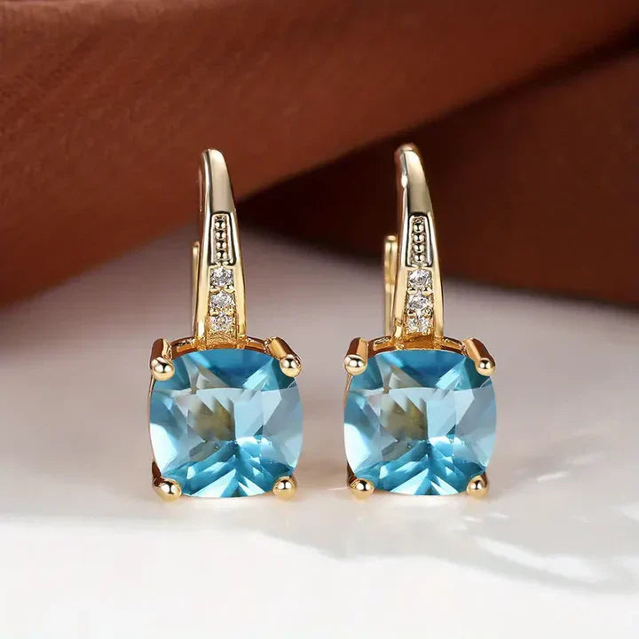 Pendientes de aro de oro con piedras misteriosas