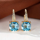 Pendientes de aro de oro con piedras misteriosas