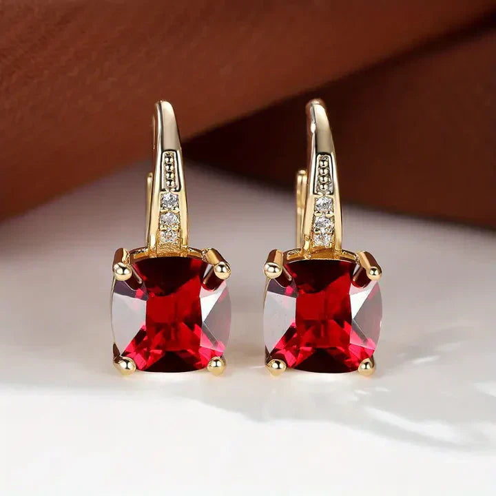 Pendientes de aro de oro con piedras misteriosas