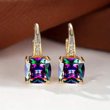 Pendientes de aro de oro con piedras misteriosas