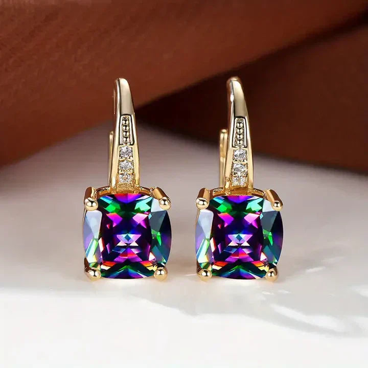 Pendientes de aro de oro con piedras misteriosas