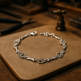 Pulsera con dijes de pata de perro y hueso en plata pura, edición limitada