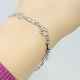Pulsera con dijes de pata de perro y hueso en plata pura, edición limitada