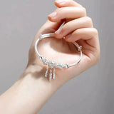 Brazalete ajustable con hojas de plata