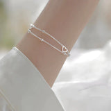 Brazalete ajustable con corazón de plata