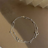 Brazalete ajustable con corazón de plata