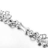 Pulsera con dijes de pata de perro y hueso en plata pura, edición limitada