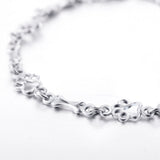 Pulsera con dijes de pata de perro y hueso en plata pura, edición limitada