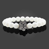 Pulsera con cuentas en forma de pata – diseño en piedra natural