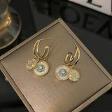 Pendientes caleidoscópicos dorados