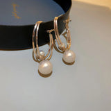 Pendientes encantadores con perlas