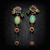 Pendientes vintage con ópalo azul y cristales rojos en oro