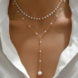 Collar de dos vueltas de perlas con colgantes