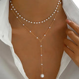 Collar de dos vueltas de perlas con colgantes