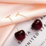 Aretes lujosos de color cereza