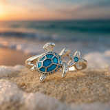 Anillo plateado con tortuga y ópalo azul