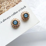 Pendientes vintage con piedras azules y perlas doradas