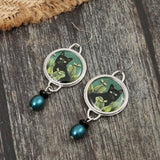 Pendientes vintage con gato negro tropical