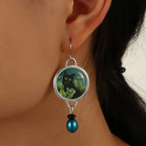 Pendientes vintage con gato negro tropical